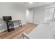 Bright bedroom featuring wood flooring, a daybed, a ceiling fan, and a sleek desk at 1055 Royalist Rd, Mount Pleasant, SC 29464