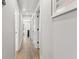 Hallway showcasing wood flooring and white trim throughout at 1055 Royalist Rd, Mount Pleasant, SC 29464