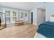 Bright main bedroom with blue accent walls, natural light, and access to a walk-in closet at 1055 Royalist Rd, Mount Pleasant, SC 29464