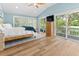 Spacious main bedroom with vaulted ceilings, a deck, and wood flooring at 1055 Royalist Rd, Mount Pleasant, SC 29464