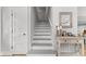 Inviting entry staircase with light gray treads, leading to the upper level at 1055 Royalist Rd, Mount Pleasant, SC 29464