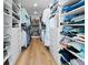 Spacious walk-in closet with custom shelving, ample storage, and wood flooring at 1055 Royalist Rd, Mount Pleasant, SC 29464