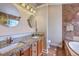 Elegant bathroom with granite countertops, double sinks, and a stylish tiled tub at 110 Salinas Ct, Summerville, SC 29483