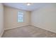 Bright and airy bedroom featuring plush carpeting and a window overlooking the backyard at 110 Salinas Ct, Summerville, SC 29483