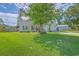 Inviting home with a manicured lawn, shade tree, two-car garage, and a paved driveway at 110 Salinas Ct, Summerville, SC 29483