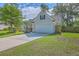 Charming home with a two-car garage, well-manicured lawn, mature trees, and a paved driveway at 110 Salinas Ct, Summerville, SC 29483