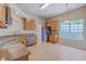 Bright kitchen with stainless steel appliances, granite countertops, wood cabinets, and tile flooring at 110 Salinas Ct, Summerville, SC 29483