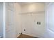Utility Room / Laundry Room with white walls, wire rack shelving and tile floor at 110 Salinas Ct, Summerville, SC 29483