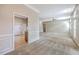 Spacious living room with neutral walls, carpet flooring, and abundant natural light from large windows at 110 Salinas Ct, Summerville, SC 29483