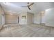 Large living room features neutral walls and carpet, decorative molding, and access to other areas of the home at 110 Salinas Ct, Summerville, SC 29483