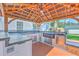 Outdoor kitchen featuring a grill, sink, and plenty of counter space for cooking at 110 Salinas Ct, Summerville, SC 29483