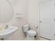 Half bath offers a pedestal sink, white toilet, and modern finishes for a clean and functional space at 111 Gavins Way, Goose Creek, SC 29445