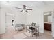 Versatile room with desk and chair, neutral walls, carpet and ceiling fan and two more rooms off of it at 111 Gavins Way, Goose Creek, SC 29445