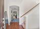 Inviting entryway boasts hardwood floors, an elegant archway, and stylish decor with a staircase on the right at 111 Gavins Way, Goose Creek, SC 29445