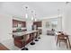 Bright kitchen with granite countertops, a large island with seating, and modern lighting fixtures at 111 Gavins Way, Goose Creek, SC 29445