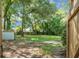 Large backyard with storage shed and mature trees offering a private outdoor space ready for landscaping or relaxation at 113 Owens Cir, Summerville, SC 29483
