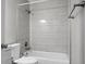 A bathroom featuring a tub with a white tile surround and a shower head at 113 Owens Cir, Summerville, SC 29483