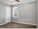 An empty bedroom with light gray walls, hard wood floors, and a single window at 113 Owens Cir, Summerville, SC 29483