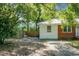 View of the side of the home showcasing the siding exterior, driveway, and a fenced yard space at 113 Owens Cir, Summerville, SC 29483