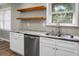 Kitchen features granite counters, stainless steel appliances and floating wood shelving at 113 Owens Cir, Summerville, SC 29483