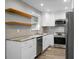 Stylish kitchen boasts granite countertops, stainless steel appliances, and floating shelves at 113 Owens Cir, Summerville, SC 29483