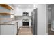 Modern kitchen features stainless steel appliances, granite counters, and ample cabinet space at 113 Owens Cir, Summerville, SC 29483