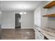 Bright kitchen area showcases granite countertops and a stylish chandelier at 113 Owens Cir, Summerville, SC 29483