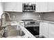 Stainless steel oven in kitchen featuring stylish cabinets, counters, and backsplash at 113 Owens Cir, Summerville, SC 29483