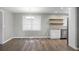 Spacious living room with hardwood floors and an open floor plan, seamlessly connecting to the adjacent kitchen at 113 Owens Cir, Summerville, SC 29483