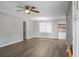 Bright living room featuring neutral walls, wood floors, a ceiling fan, and an open layout at 113 Owens Cir, Summerville, SC 29483
