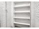 Close up of white shelving built into the brick wall with additional white brick wall adjacent at 113 Owens Cir, Summerville, SC 29483