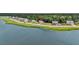 Enjoy serene water views from this home's location, nestled near a tranquil lake and lush greenery at 1132 Wading Point Blvd, Huger, SC 29450