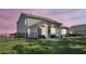 View of the cozy covered back patio and fenced backyard at 1132 Wading Point Blvd, Huger, SC 29450