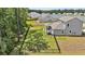 Aerial view of home's backyard, featuring a covered patio, firepit, and spacious yard at 1132 Wading Point Blvd, Huger, SC 29450