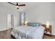 Comfortable bedroom featuring a ceiling fan, large window, and a cozy bed at 1132 Wading Point Blvd, Huger, SC 29450