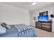 Inviting bedroom with a comfortable bed, modern dresser, and a scenic view at 1132 Wading Point Blvd, Huger, SC 29450