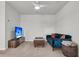 Bonus room with a ceiling fan, a blue sofa and a TV at 1132 Wading Point Blvd, Huger, SC 29450