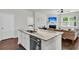 Open kitchen with granite countertops, stainless steel dishwasher, and easy access to the living and bedroom areas at 1132 Wading Point Blvd, Huger, SC 29450