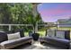 Relaxing patio area with outdoor seating, potted plants, and a stunning sunset backdrop at 1132 Wading Point Blvd, Huger, SC 29450