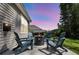 View of the cozy patio with four Adirondack chairs around a fire pit at 1132 Wading Point Blvd, Huger, SC 29450