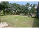 Expansive backyard featuring mature trees, a shed, and ample space for recreation and outdoor activities at 116 Cone Ln, Summerville, SC 29483