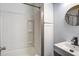 Bathroom with white cabinets, a shower, and a mirror at 116 Cone Ln, Summerville, SC 29483