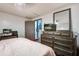 Bright bedroom with a dresser and a door leading to a bathroom at 116 Cone Ln, Summerville, SC 29483