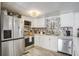 Charming kitchen with stainless steel appliances, white cabinetry, and modern countertops at 116 Cone Ln, Summerville, SC 29483