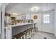 Kitchen with bar seating, white cabinets, and modern appliances at 116 Cone Ln, Summerville, SC 29483