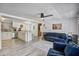 Open-concept living room with a modern ceiling fan, wood floors, and view of the kitchen at 116 Cone Ln, Summerville, SC 29483