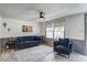 Cozy living room with wood floors, natural light, and comfortable blue furniture at 116 Cone Ln, Summerville, SC 29483