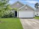 Exterior elevation featuring a gray home with a white garage at 120 Larkspur Dr, Goose Creek, SC 29445