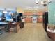 Open kitchen with black appliances and wood cabinets open to the living area at 120 Larkspur Dr, Goose Creek, SC 29445