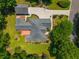 Aerial view of home featuring backyard deck, detached garage with basketball court and lush, landscaped lawn at 121 Arrowridge Ct, Summerville, SC 29485